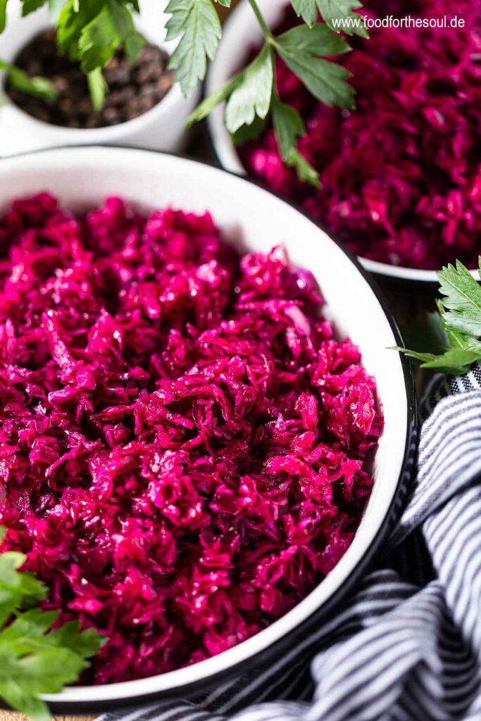 German Red Cabbage Salad in a bowl garnished with parsley