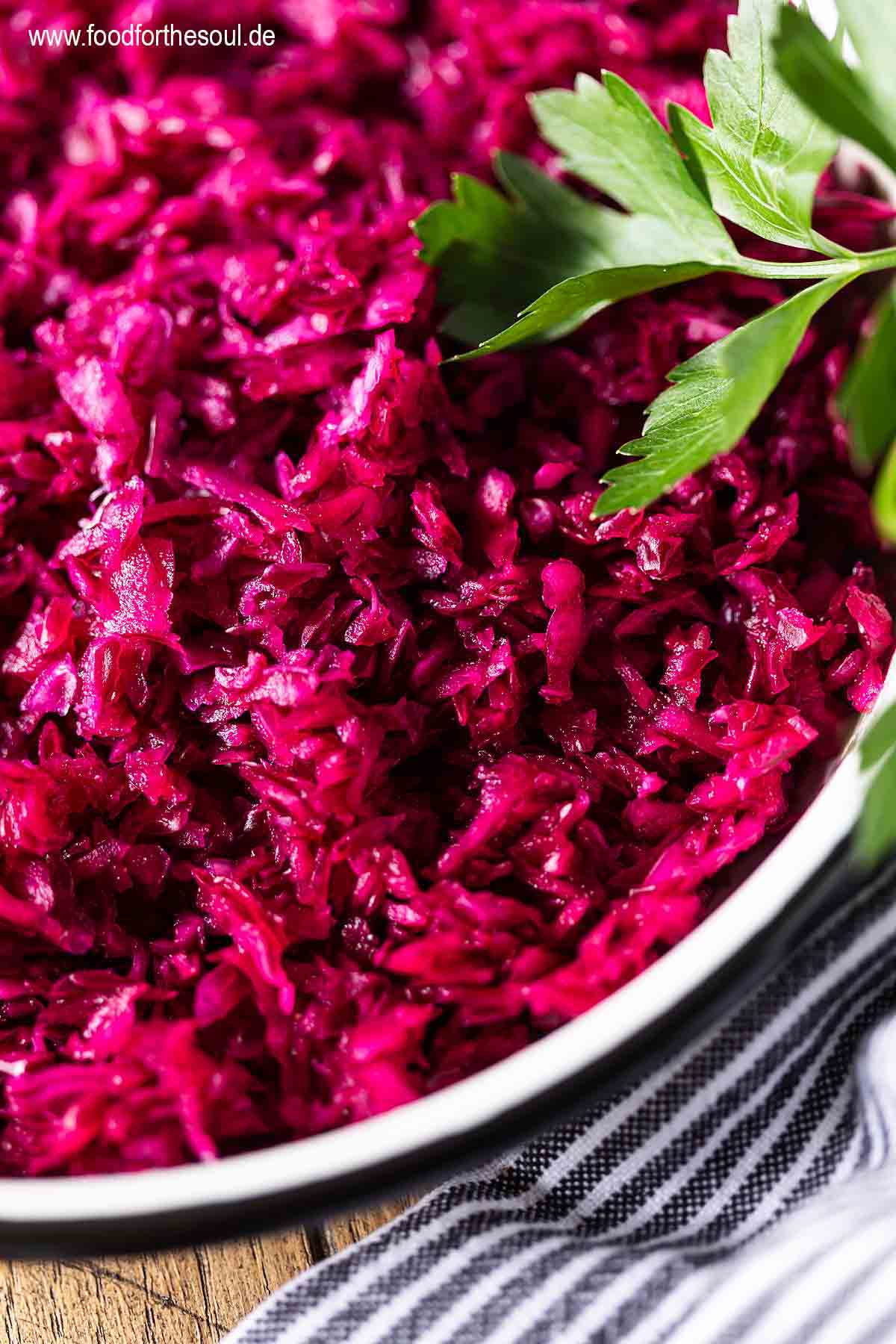 German Red Cabbage Salad in a bowl garnished with parsley