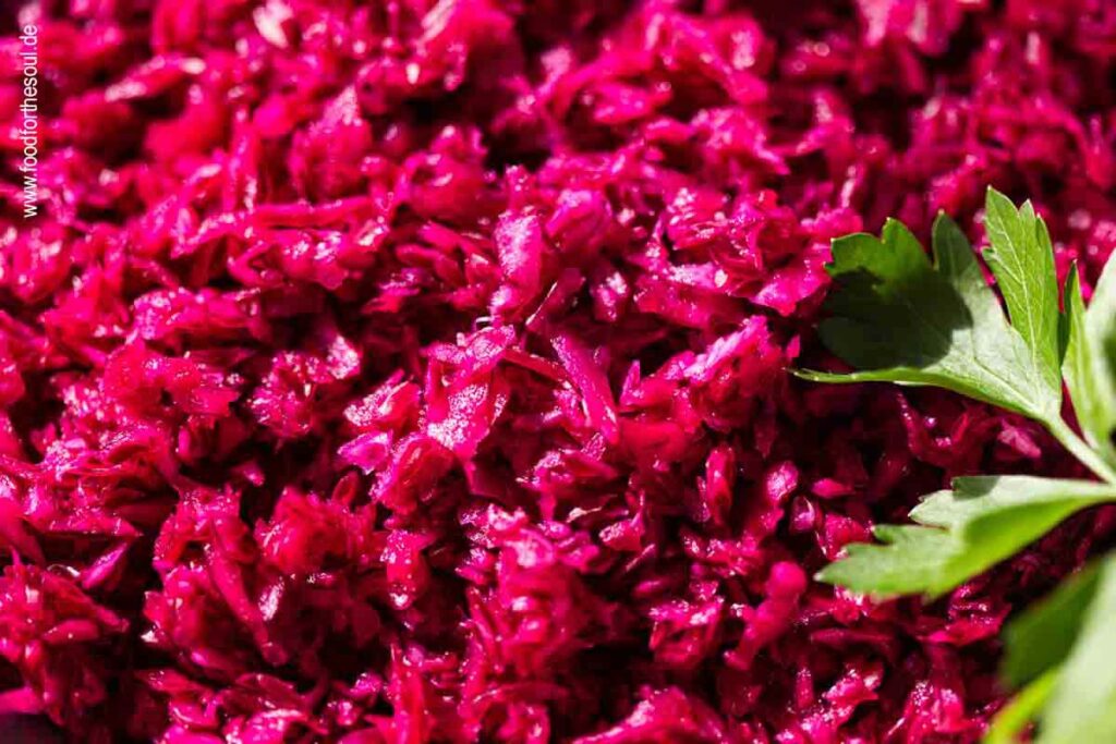 German Red Cabbage Salad in a bowl garnished with parsley