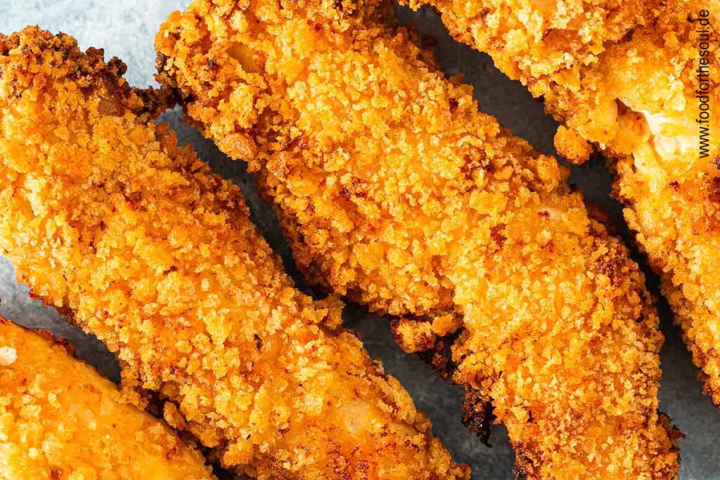 Frisch panierte und frittierte Hähncheninnenfilets